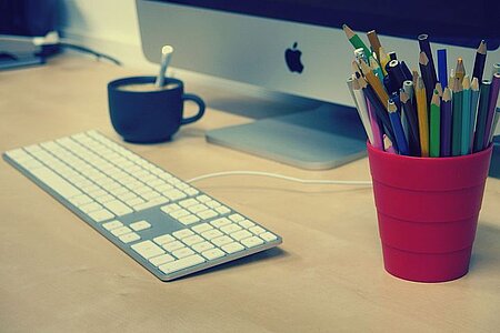 Desk with computer and mug
