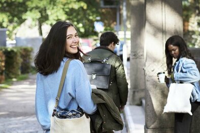 Three students on campus. 